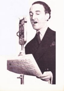 Maurice Elwin in Front of the Microphone